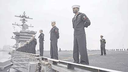 SAN DIEGO (Jan. 5, 2017) Sailors aboard the aircraft carrier USS Carl Vinson (CVN 70) man the rails as the ship departs its homeport of San Diego. The Carl Vinson Carrier Strike Group is departing on a scheduled deployment to the Western Pacific where it will conduct bilateral exercises in the Indo-Asia-Pacific region. U.S. Navy photo by MC2 Sean M. Castellano.