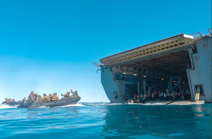 U.S. Marines with 31st Marine Expeditionary Unit recover aboard the amphibious transport dock USS San Diego (LPD 22) during a shore-to-ship movement, utilizing the Enhanced Combat Rubber Reconnaissance Craft as a part of exercise Talisman Sabre 25, in the Coral Sea, July 14, 2025. Marines conducted the shore-to-ship movement to improve amphibious raid capabilities and sustain small boat skills. Talisman Sabre is the largest bilateral military exercise between Australia and the United States advancing a free and open Indo-Pacific by strengthening relationships and interoperability among key allies and partners, while enhancing our collective capabilities to respond to a wide array of potential security concerns. (U.S. Marine Corps photo by Lance Cpl. Trevor BishopWilliams)