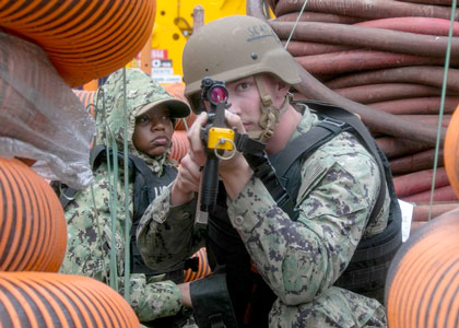 Aviation Ordnanceman 3rd Class Greyson Burkhart, Marion, Massachusetts, right, and Logistics Specialist 3rd Class Christavia Dozier, from York, Alabama, assigned to amphibious assault carrier USS Tripoli (LHA 7), participate in an anti-terrorism force protection assessment, Mar. 12, 2025. Tripoli is an America-class amphibious assault ship homeported in San Diego. U.S. Navy photo by Mass Communication Specialist Seaman Paul LeClair